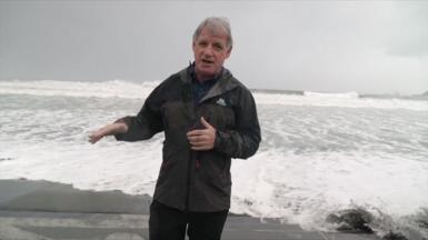 Correspondent Jonathan Head in Luzon Island on a beach as a storm approaches