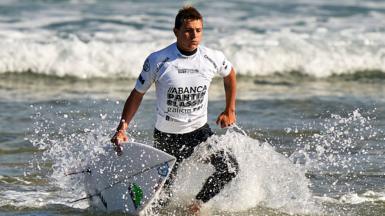 Arran Strong competing at a surfing event in Spain in 2020