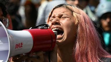 A protester in the US shouts into a megaphone