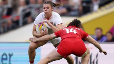 Helena Rowland carries the ball