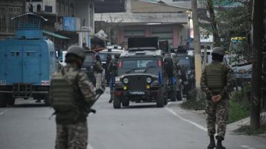  Security forces patrol the street near Wuyan area of Pampore in south Kashmir 