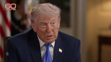 US President Donald Trump wears a blue tie.