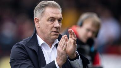 Scott Lindsey applauds the Crawley Town fans after a League Two match