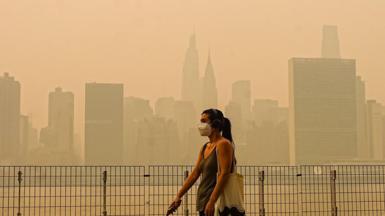 Smoke from massive wildfires in Canada engulfed the New York City skyline, reducing visibility and casting an orange haze over the New York City, United States on July 16, 2026.