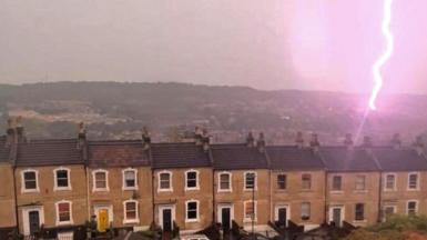 Lightning strikes near a row of houses in Bath, Somerset