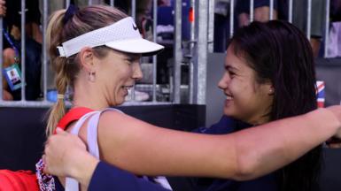 Katie Boulter and Emma Raducanu share a hug at the 2024 BJK Cup Finals