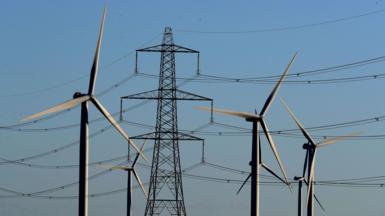File photo dated 28/12/17 of a view of the Little Cheyne Court Wind Farm amongst existing electricity pylons on the Romney Marsh in Kent.