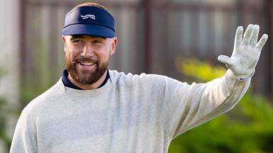 Travis Kelce waves before the start of the second round of the AT&T Pebble Beach Pro-Am in 2026
