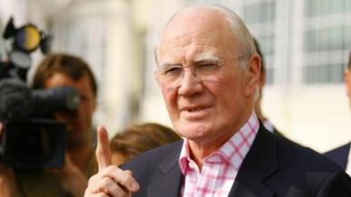 Menzies Campbell campaigning. The photo shows him with his finger pointing into the air as he emphasises a point