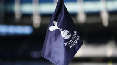 A corner flag with Tottenham's badge on it