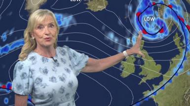 BBC Weather presenter, Carol Kirkwood, pointing at graphic showing Storm Floris