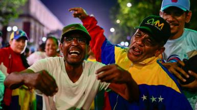 Supporters of President Maduro celebrate in Caracas