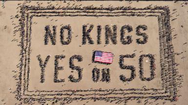 Aerial picture shows protesters forming a human banner during the No Kings rally in San Francisco, California on 18 October 2025 