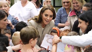 Catherine meets children in Italy