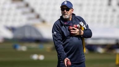Northamptonshire head coach Darren Lehmann holds three cricket balls