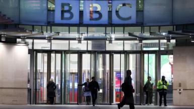 People walk outside the BBC headquarters in London on 11 November 2025 
