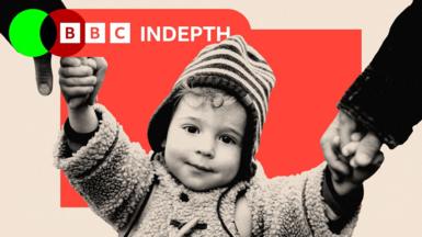 A child wearing a coat and hat, holding hands with their parents