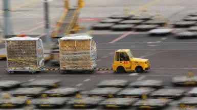  A vehicle transports air mail over the grounds of the DHL hub at the airport in Leipzig on March 07, 2019 in Leipzig, Germany