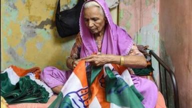 woman stitching  election material at home