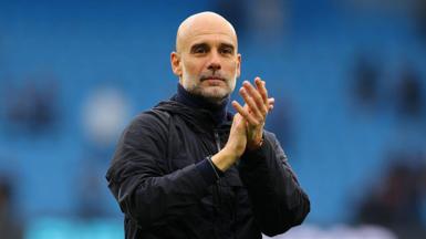 Pep Guardiola applauds fans after Manchester City's Premier League match against Brentford in May