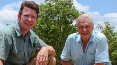 Adam Britton poses with David Attenborough and a crocodile