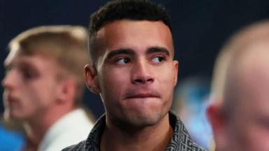 Close up of young man looking to the side with serious face