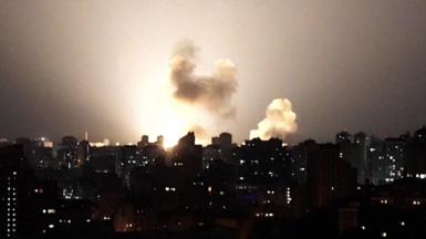 Ukraine skyline at night lit up by a missile