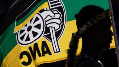 An ANC flag flies at a rally in May.