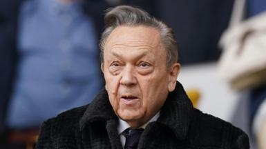 David Sullivan, wearing a dark coat and tie, shown down to his shoulders.
