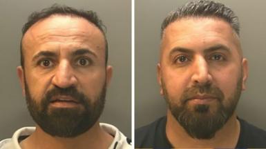 Police mugshot of Dilshad Shamo and Ali Khdir. Shamo is on the left and had a beard and is looking at the camera. Khdir is on the right and is wearing a dark blue t-shirt, he also has a beard.