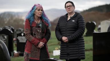 Women in cemetery