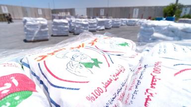 Sacks of rice are seen waiting to cross into Gaza
