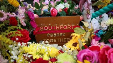 Flowers gathered in tribute following the Southport attack in September 2024