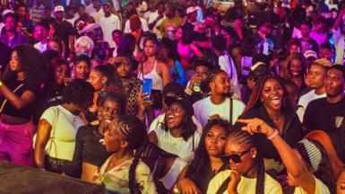 A crowd of young people in the audience looking at the stage at a music event during Detty December in Lagos, Nigeria, 2024