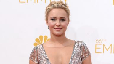 Hayden Panettiere on the Emmys red carpet wearing a silver glittery dress.
