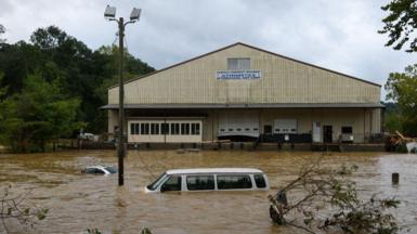 A car is submerged in water as the storm Helene blew through Asheville, North Carolina