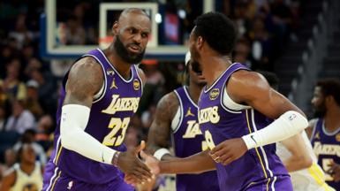 LeBron James and son Bronny on court for LA Lakers against Golden State Warriors