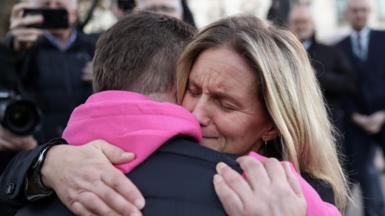 Kim Leadbeater hugs a campaigner for assisted dying 