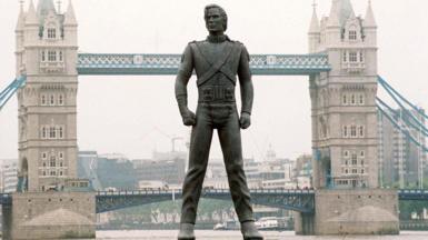 A giant Michael Jackson statue appears to be stood on the River Thames in front of Tower Bridge.