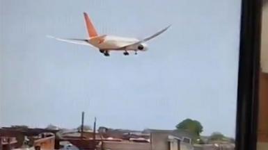 Air India passenger plane descends over neighbourhood