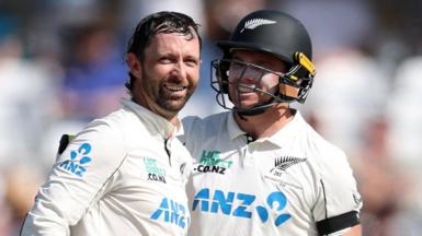 New Zealand openers Devon Conway (left) and Tom Latham (right) embrace and smile