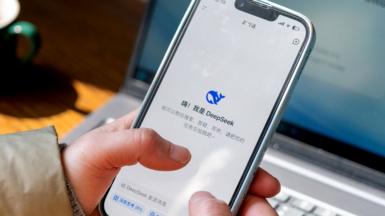 The DeepSeek app from a Chinese AI technology company is displayed on a mobile phone
