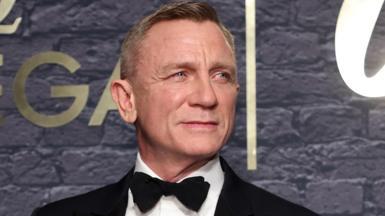 Daniel Craig in a suit as James Bond 