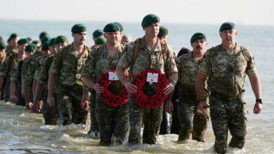 A beach landing by the Royal Marines of 47 Commando at Asnelles before their annual 'yomp' to Port-en-Bessin, in Normandy, France