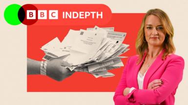 A hand holds ballot papers and Laura Kuenssberg is pictured on the right