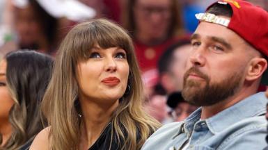 Singer Taylor Swift tilts her head up while sitting next to fiance Travis Kelce of the Kansas City Chiefs at Game Three between the New York Knicks and the Cleveland Cavaliers in the NBA Eastern Conference Finals.
