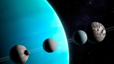 Artwork of Uranus and five of its moons