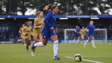 Johanna Rytting Kaneryd, of Chelsea, in action during the Women's FA Cup fourth round match against Crystal Palace. She has blonde hair, tied back, and is looking in front of her as she runs with the ball. Several other players can be seen in the background.