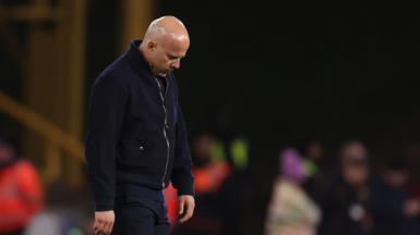 Arne Slot looks down in despondency