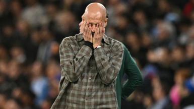 Pep Guardiola has his head in his hands during Man City's loss to Real Madrid in the Champions League